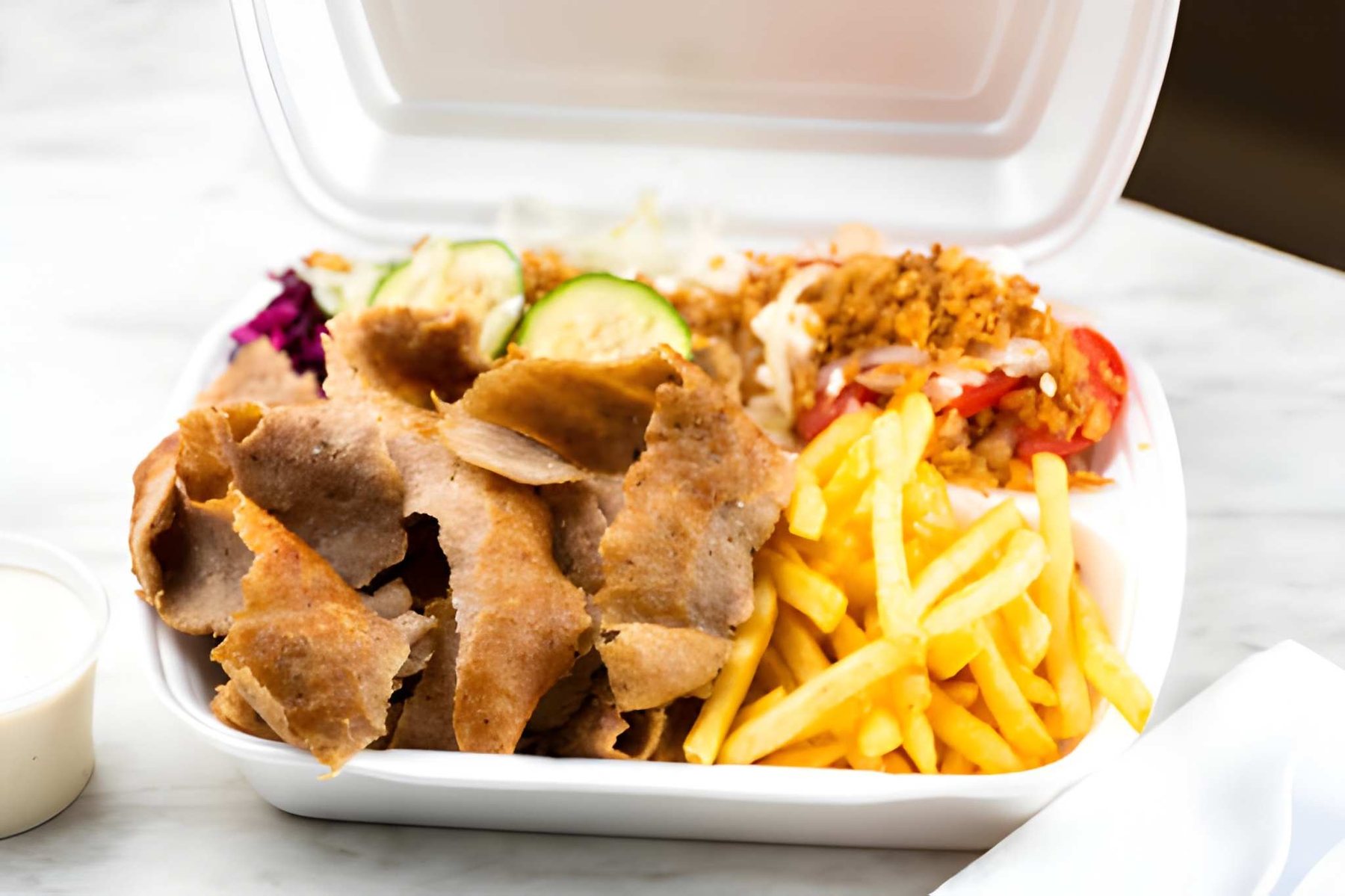 Kebab Palace special meat tray with chips and salad